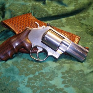 S & W Model 629-3 Lew Horton Custom limited edition in .44 Magnum.  Hogue custom Rosewood Grips.  Magnaported barrel.
Dick Murray custom flap hols