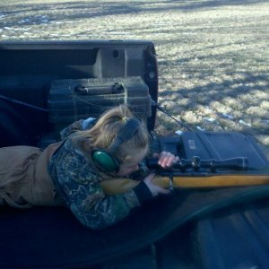 My daughter learning to shoot.