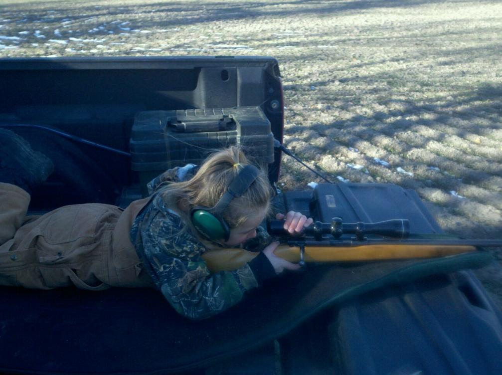 My daughter learning to shoot.
