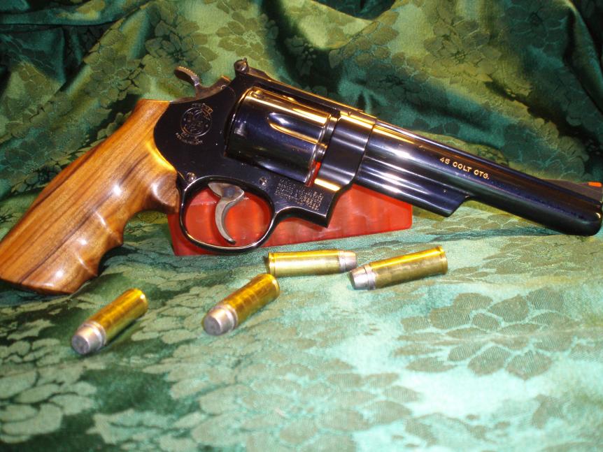 S &amp; W Model 25-5  in .45 Colt.  Hogue custom Goncalo Alves grips.