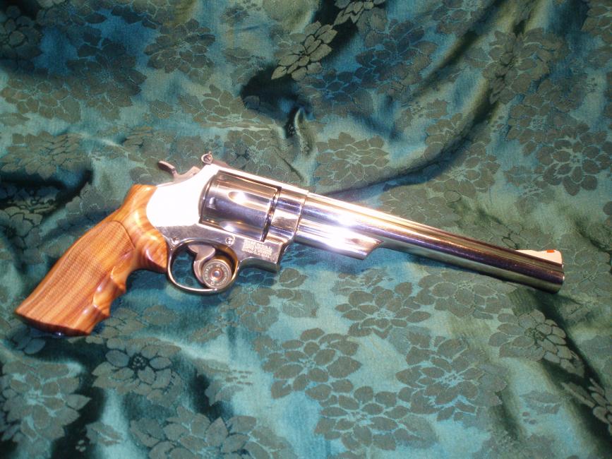 S &amp; W Model 29-3 in .44 Magnum.  Factory nickel finish; Hogue custom Rosewood grips.